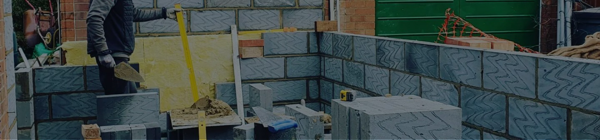 cinder blocks being laid by a builder